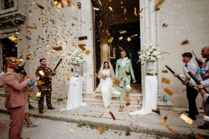 Bride and groom exiting the church after their wedding in Bale – Istria